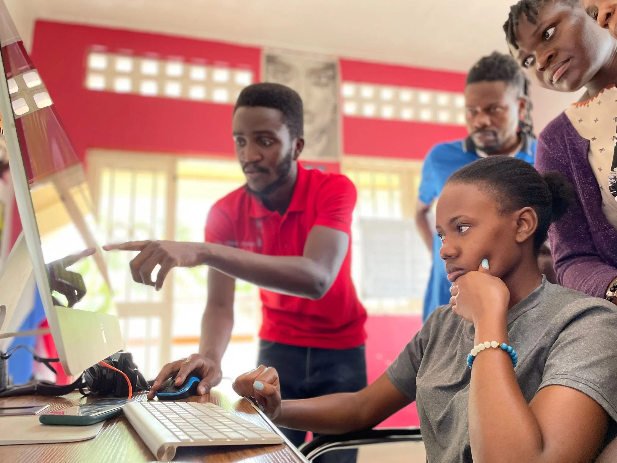 Girls learning how to edit in our editing lab of Uganda17